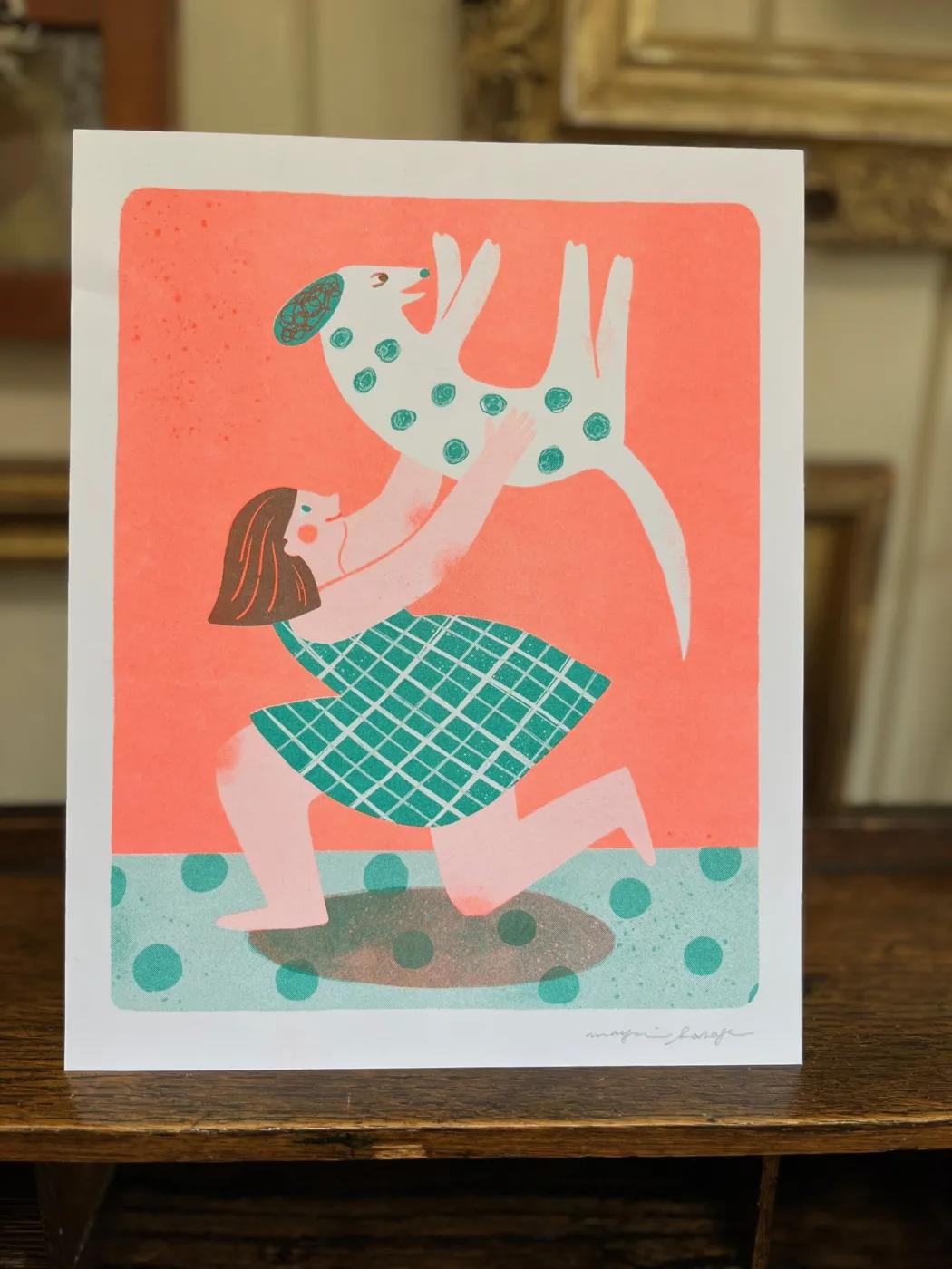 Illustration of a person lifting a spotted dog.